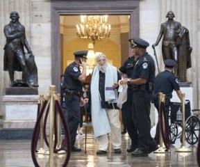 Photo of Rabbi Waskow being arrested in the US Capitol