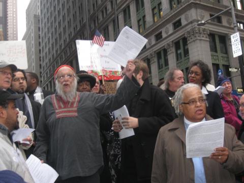 Photo of  Rabbi Waskow chanting a new "Dayenu" as Elders lead prayer among Occup