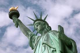 Lady Liberty in NY Harbor, focused on the Lamp she lifts