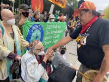 Photo of Rabbis Waskow & Berman with Indigenous Leader at White House protest & arrest on his birtday (or b’earth-day)